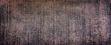 Koyu çivit rengi kot kumaş arka planının yakın çekimi. Kot pantolon arka planının dokusu