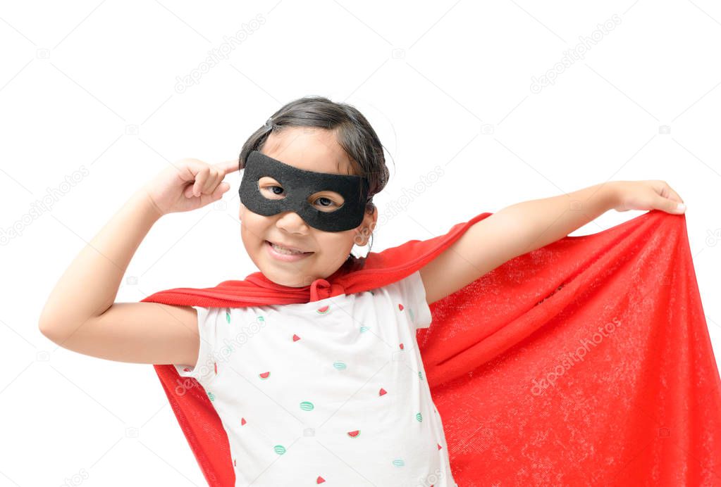 Little child plays superhero isolated on white background, Girl power concept.