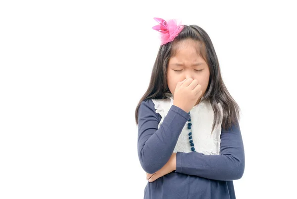 Kid gesture smells bad. Portrait of girl pinches nose with fingers hands with disgust something stinks bad smell situation. Human face expression body language reaction isolated on white