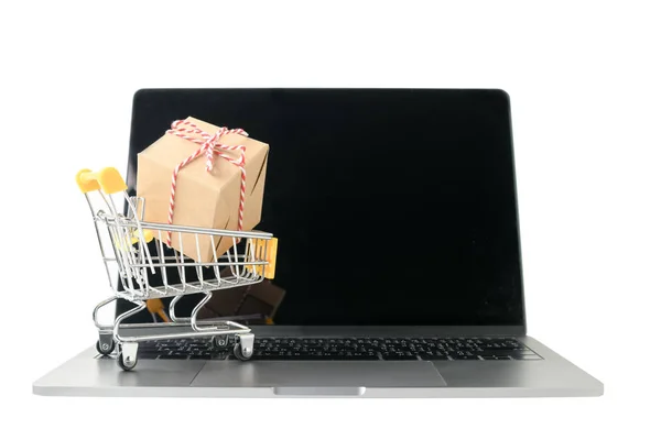 Boxes in a trolley on a laptop keyboard isolated — Stock Photo, Image