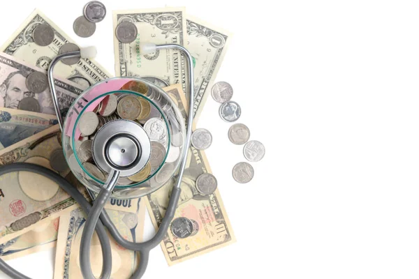 Stethoscope in a jar contains coins — Stock Photo, Image