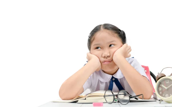 Chica aburrida y cansada haciendo la tarea — Foto de Stock