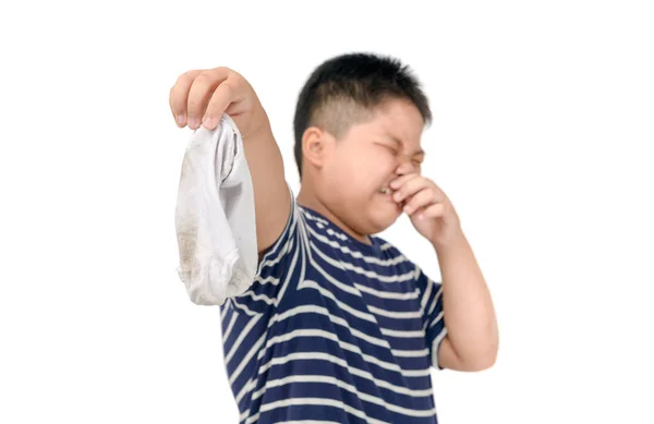 Fat boy holding dirty stinky socks isolated — Stock Photo, Image