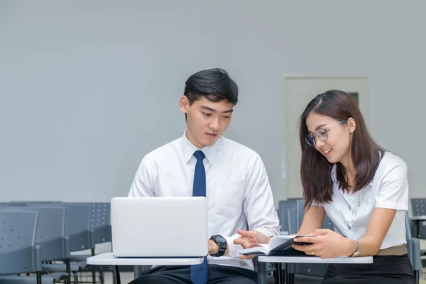 Students in uniform working and reading — Stock Photo, Image