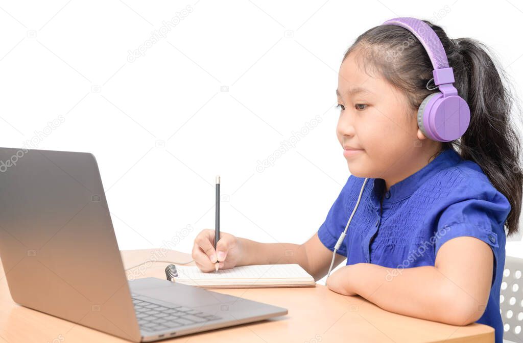 Happy girl student doing homework with headphone  and enjoy online isolated on white background. new normal concept
