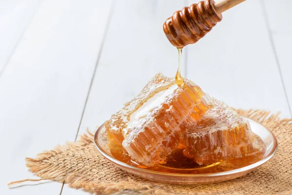 Pouring Fresh Honey Honeycomb Dish White Wood Background Bee Products — Stock Photo, Image