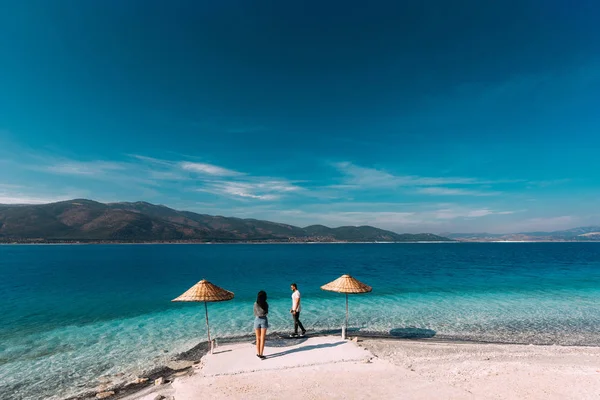 Couple in love in the Blue lagoon. Lovers on the coast. Boy and girl in Turkey. Couple on beach. Man and woman on the island. Couple on vacation. Honeymoon trip. Couple on the lake. Lake Salda