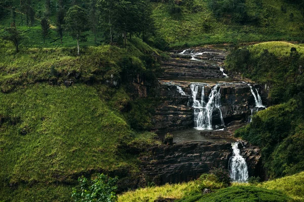 Waterfall among the green mountains. Waterfalls Of Sri Lanka. Landscapes Of Asia. Aerial photography. Tea plantation. Green hill. Mountain river. Small waterfall. Sri lanka