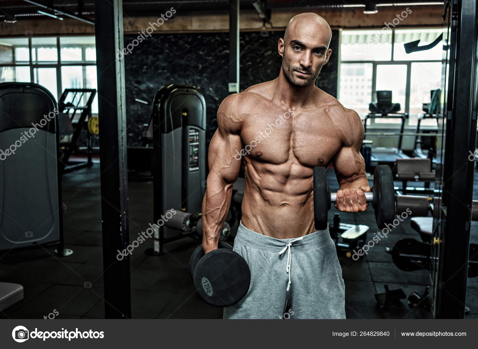 https://st4.depositphotos.com/3034073/26482/i/1600/depositphotos_264829840-stock-photo-young-handsome-sportsman-bodybuilder-weightlifter.jpg