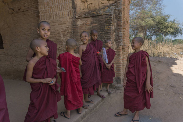 kids buddhist monks  in temple of angkor wat, cambodia