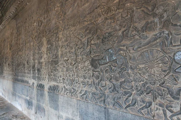 the ancient stone carving on the wall of an antique temple