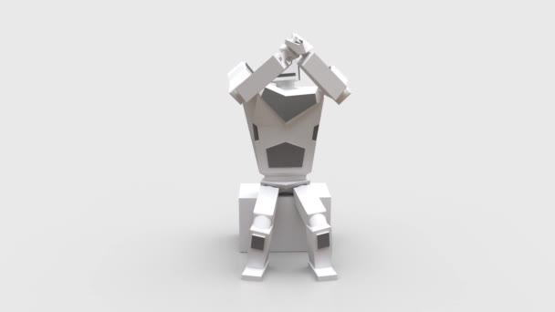 robot humanoïde moderne assis sur un cube et applaudit .