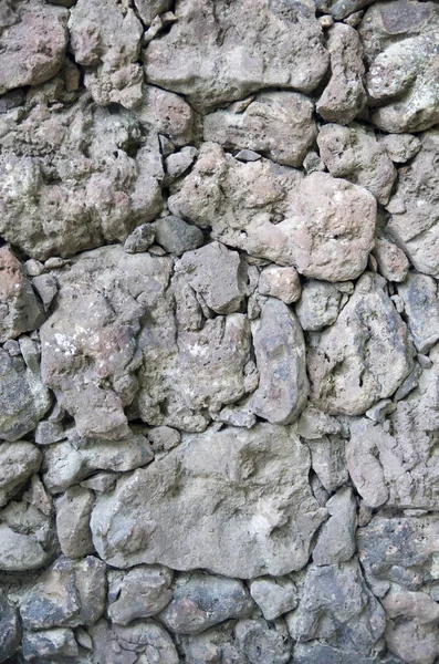 Wall of relief colorful volcanic  stone  closeu