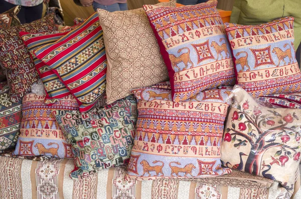 Many colorful armenian pillows closeup in sunny da