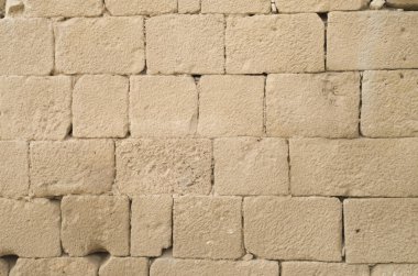 Eski kabartma sarı kireçtaşı duvar closeu