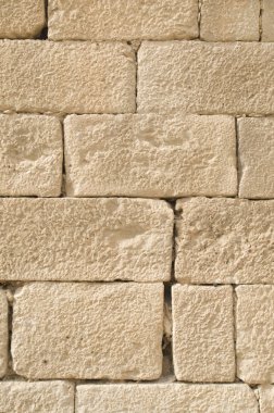 Eski kabartma sarı kireçtaşı duvar closeu