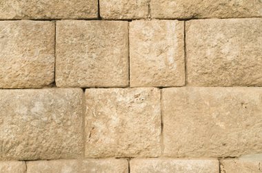 Eski kabartma sarı kireçtaşı duvar closeu