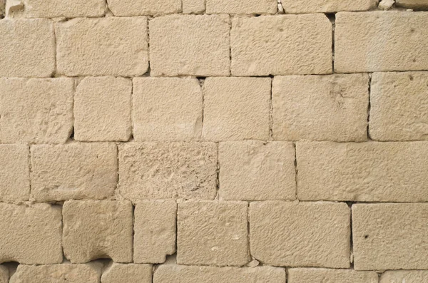 Eski kabartma sarı kireçtaşı duvar closeu