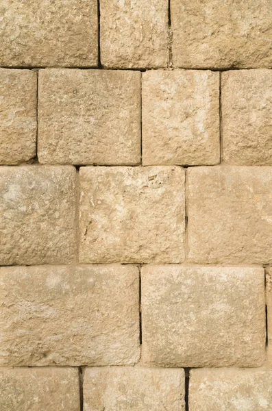 Eski kabartma sarı kireçtaşı duvar closeu