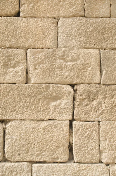 Eski kabartma sarı kireçtaşı duvar closeu