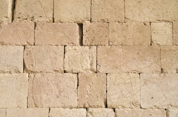 Eski kabartma sarı kireçtaşı duvar closeu