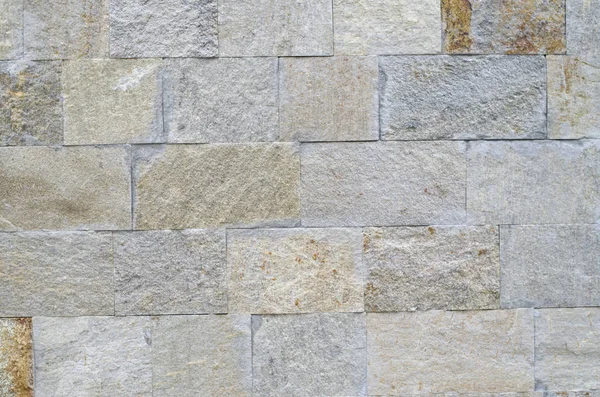 Nuevo revestimiento de piedra pulida en primer plano de la pared — Foto de Stock