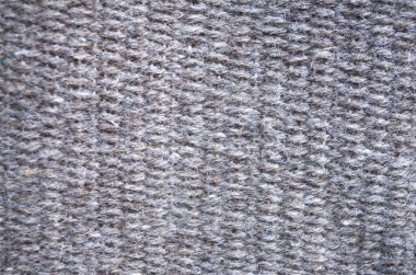 Yeni örülmüş kahverengi yün halı kapanışı