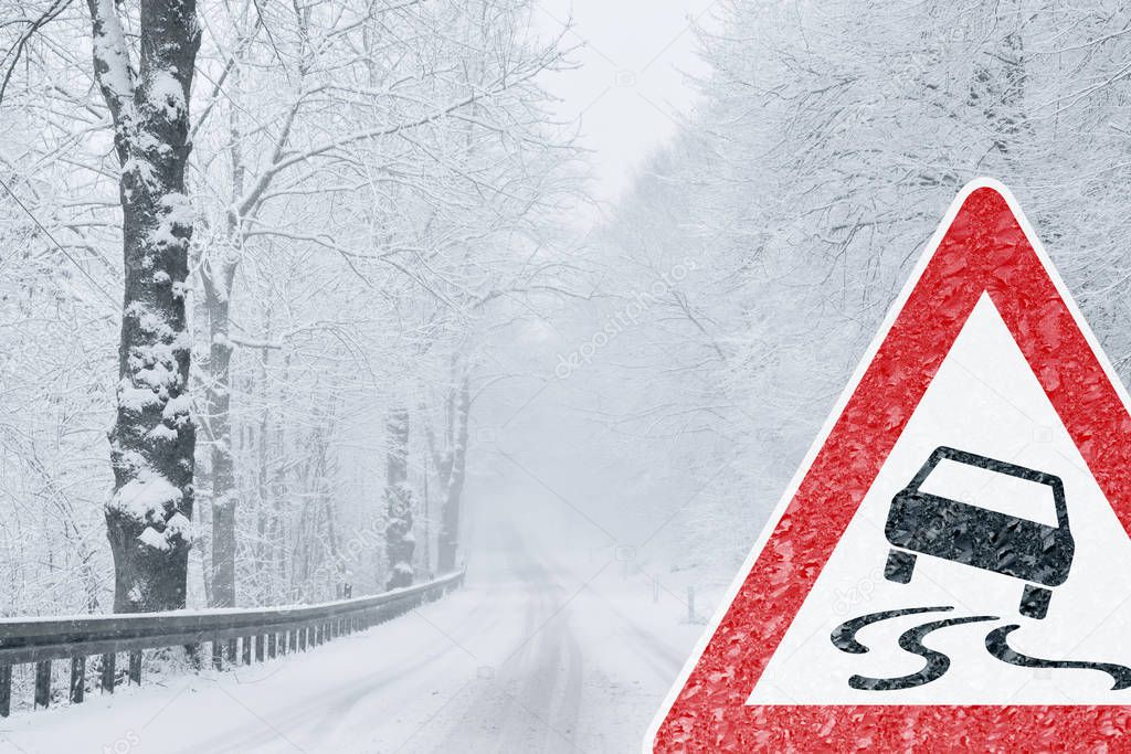 Winter Driving - Snowy Road with Warning Sign 