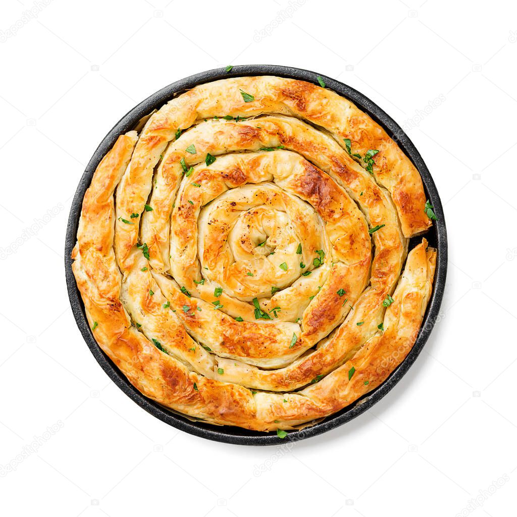 Traditional feta cheese phyllo pastry pie isolated on white background .