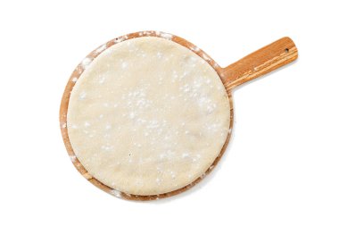 Fresh raw dough for pizza or bread baking on wooden cutting board isolated on white background. top view clipart