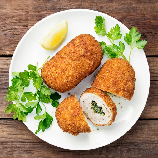Breaded Chicken Kiev breast stuffed with butter, garlic and herbs. top view