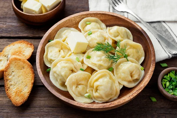 Homemade meat dumplings - russian pelmeni. Dumplings, filled with meat, ravioli.