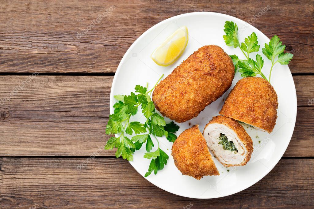 Breaded Chicken Kiev breast stuffed with butter, garlic and herbs. top view