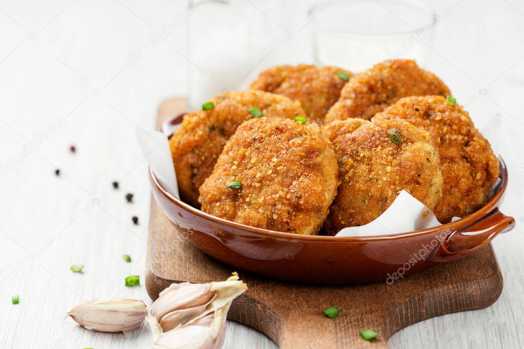 Delicious crispy fried breaded chicken patties .