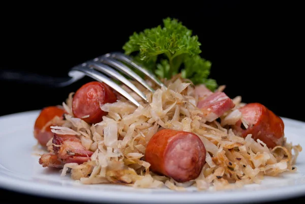 German, Polish, Austrian cuisine dish, Bigos - cabbage stewed with meat and sausages — Stock Photo, Image