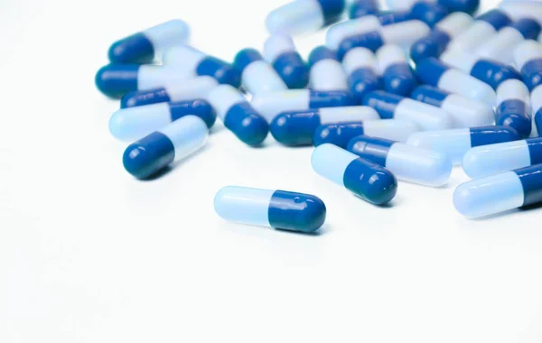 White and blue capsules — Stock Photo, Image