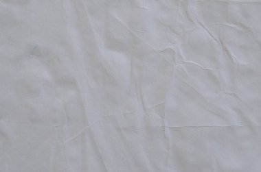 Kırışmış beyaz kağıdın dağınık kaplamasına sahip yaratıcı bir zemin.
