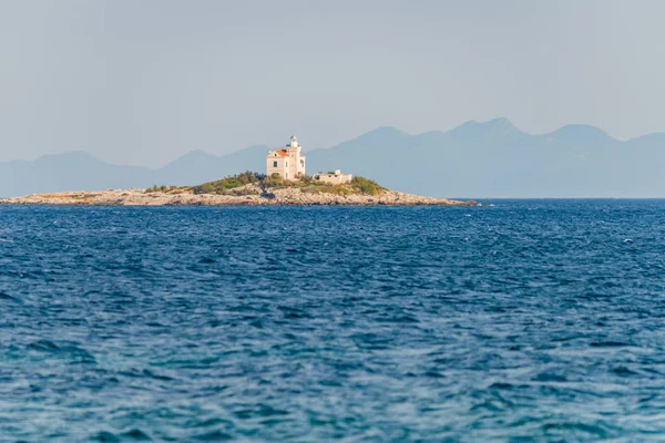 Beautiful summer seascape with lighthouse on the island in Orebi — Stock Photo, Image