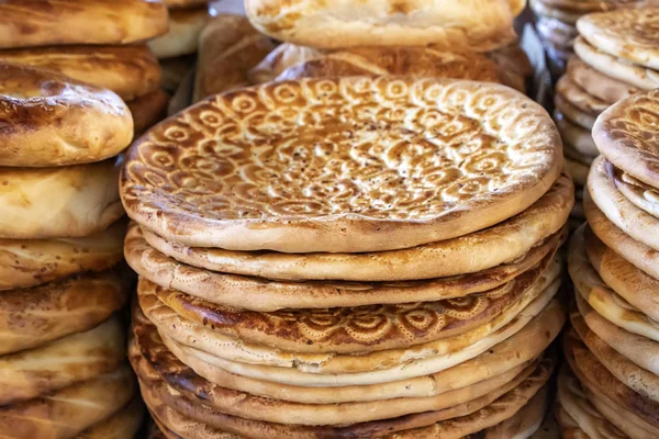 Oriental flat cakes decorated with patterns and seeds