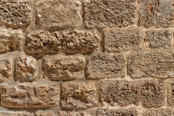 Surface of the stone wall of the masonry of Jerusalem stones