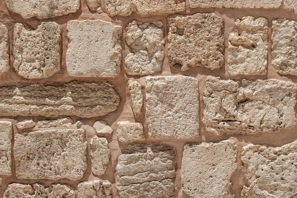 Superfície do muro de pedra da alvenaria de pedras de Jerusalém — Fotografia de Stock