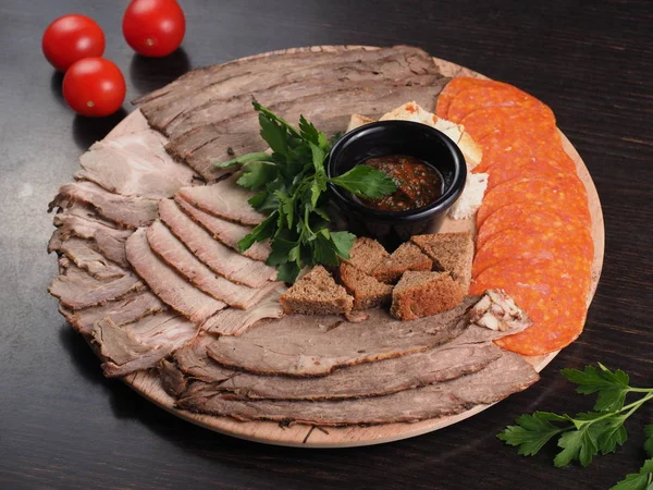 Food tray with slices of meat, bread, delicious salami - cold cuts with a choice