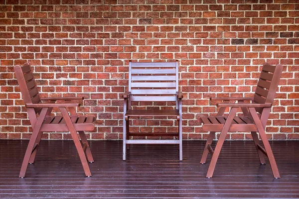 wooden chair and brick wall background
