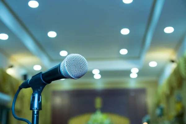 Microphone on abstract blurred in seminar room or speaking conference hall, Event Background