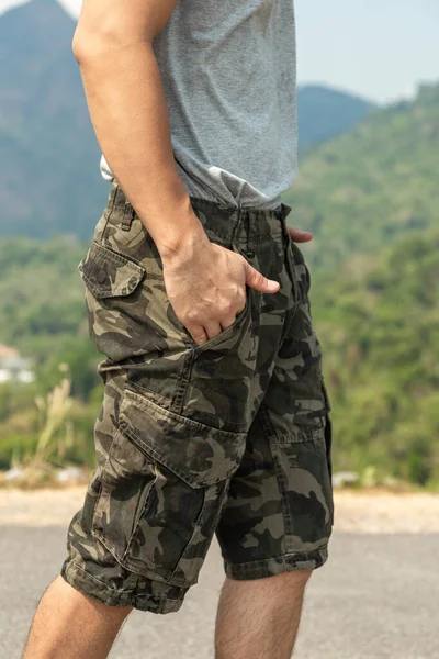 Asia man in bermuda shorts and t-shirt, outdoor activity concept