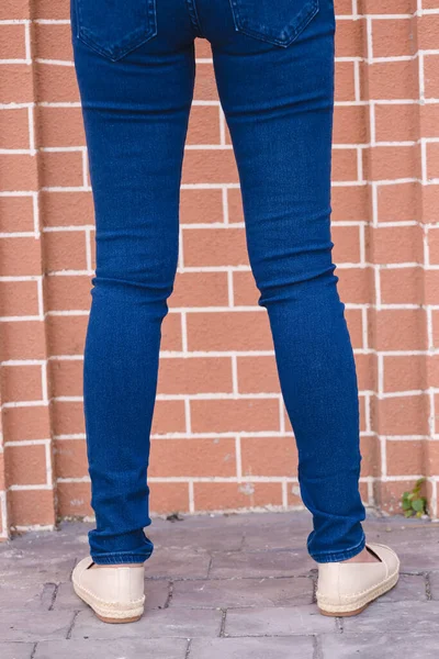 Happy Asia woman in navy blue skinny jeans, dark blue jeans