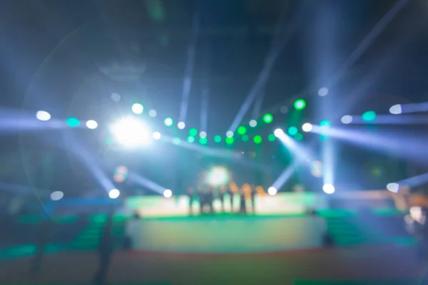 blurred background of event concert or award ceremony with lighting at conference hall
