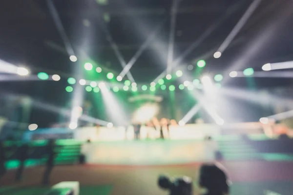 blurred background of event concert or award ceremony with lighting at conference hall