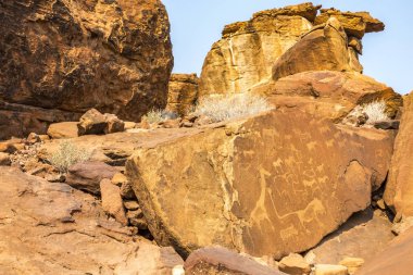The historic featuring ancient rock engravings by hunter-gatherers & Khoikhoi herders in Twyfelfontein, Namibia. clipart