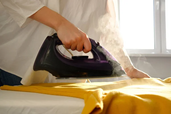 Girl Ironing Clothes Home Yellow Jacket — Stock Photo, Image